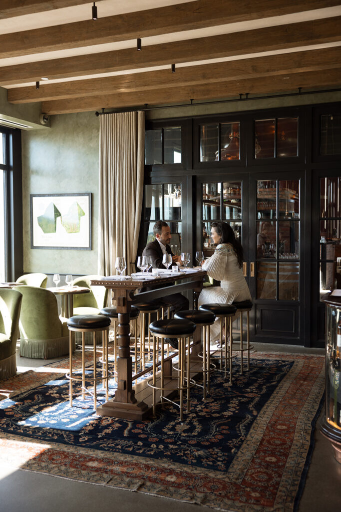Bride and groom share an intimate moment together in the bar at Klocke Estate. 