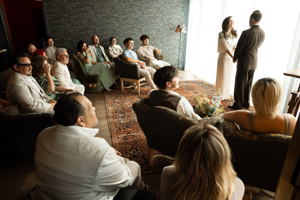 Bride and groom exchange vows on their wedding day in Upstate New York. 